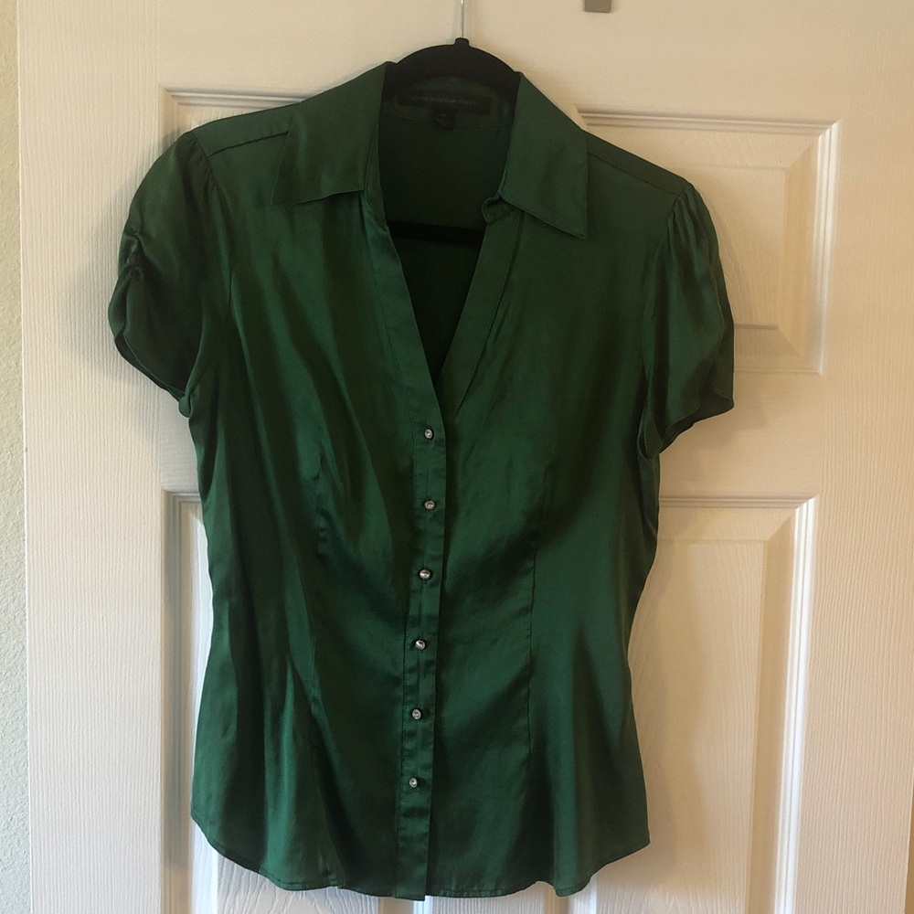 Express silk emerald green with rhinestone buttons. Semi- fitted.